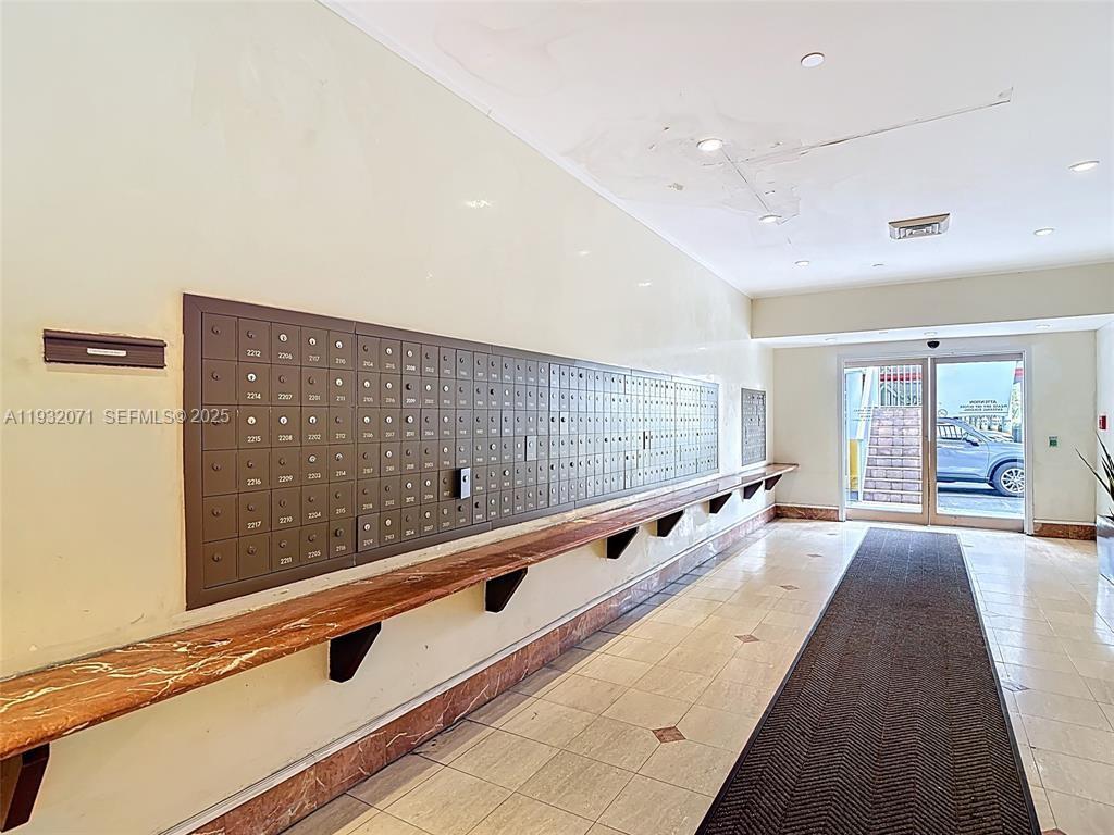 2801 Northeast 183rd Street, Unit 1504W Aventura, FL 33160 - Photo 14 of 57 a spacious bathroom with a large mirror