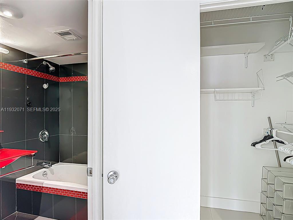 2801 Northeast 183rd Street, Unit 1504W Aventura, FL 33160 - Photo 33 of 57 a bathroom with a sink and mirror