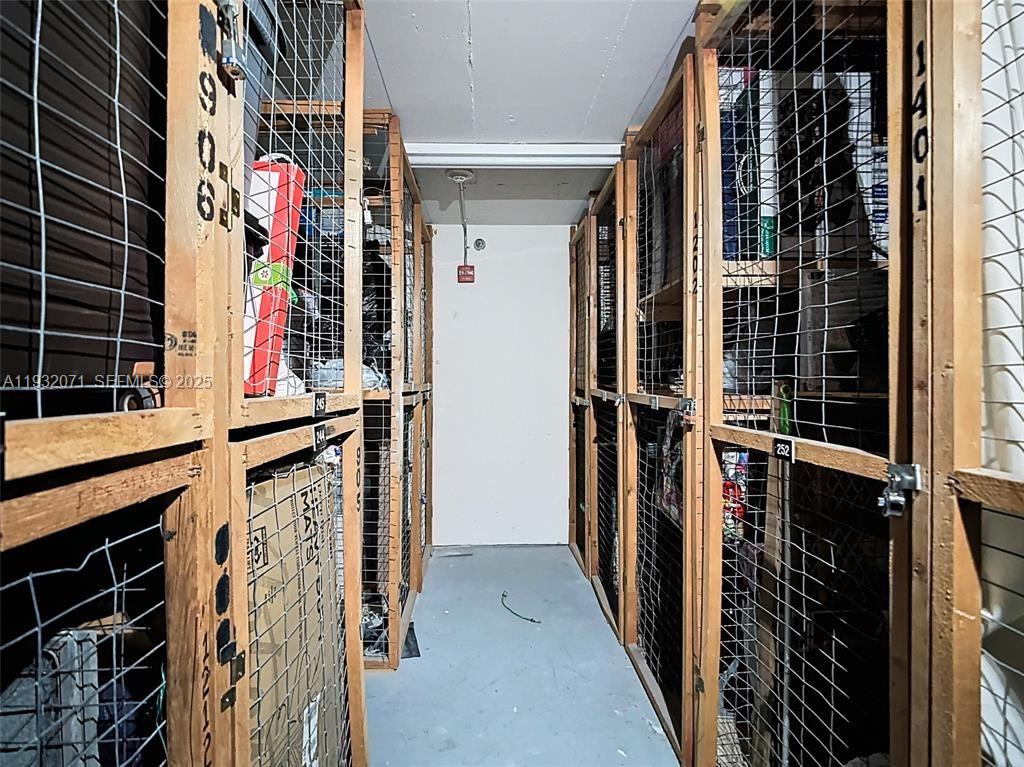 2801 Northeast 183rd Street, Unit 1504W Aventura, FL 33160 - Photo 44 of 57 a view of walk in closet with clothes
