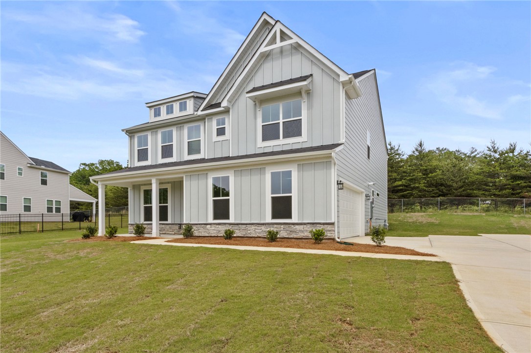313 Old Shirley Road Central, SC 29630 - Photo 28 of 30 This newly constructed residence showcases a welcoming front porch and modern architectural design.