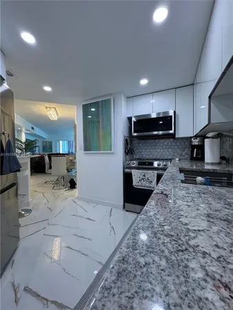 a living room with furniture a window and gym equipment