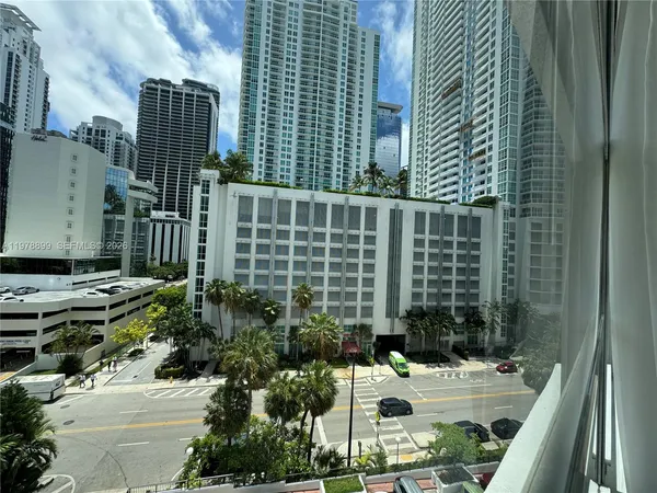 a living room with lots of furniture and umbrella
