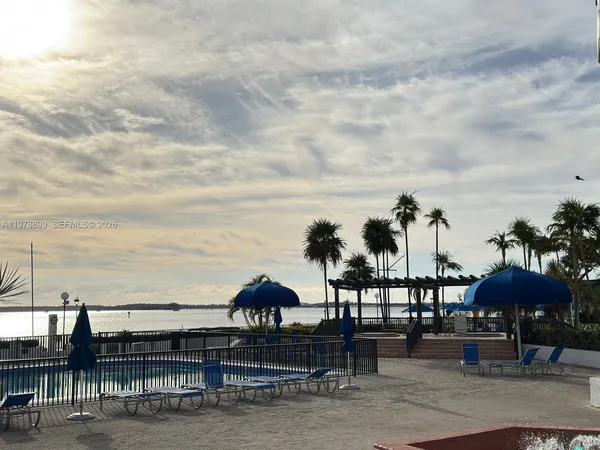 a view of a patio with table and chairs and potted plants