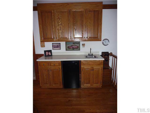 9916 Baileywick Road Raleigh, NC 27613 - Photo 14 of 25 a kitchen with a sink and cabinets