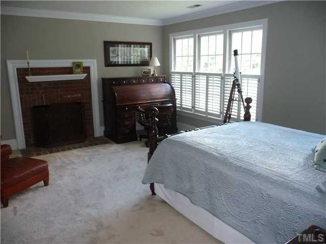 9916 Baileywick Road Raleigh, NC 27613 - Photo 15 of 25 a bedroom with a bed and a window
