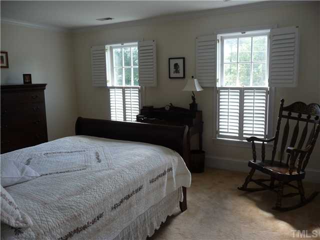 9916 Baileywick Road Raleigh, NC 27613 - Photo 19 of 25 a bedroom with a bed and a window