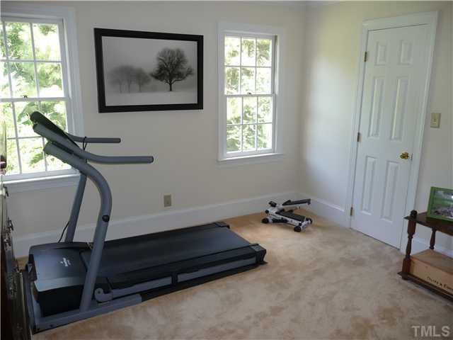 9916 Baileywick Road Raleigh, NC 27613 - Photo 20 of 25 a bedroom with bed and a window