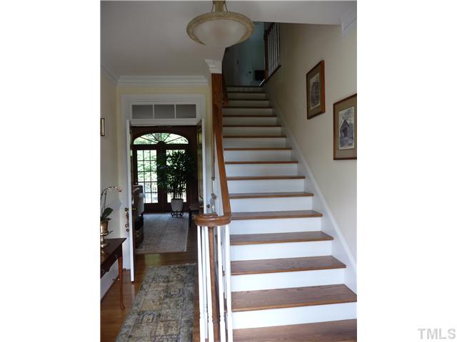 9916 Baileywick Road Raleigh, NC 27613 - Photo 4 of 25 a view of entryway and hall with wooden floor