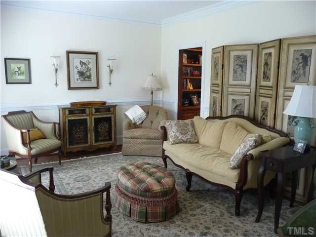 9916 Baileywick Road Raleigh, NC 27613 - Photo 5 of 25 a living room with furniture and a fireplace