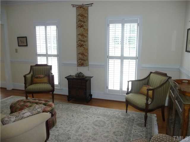 9916 Baileywick Road Raleigh, NC 27613 - Photo 6 of 25 a living room with furniture and a window