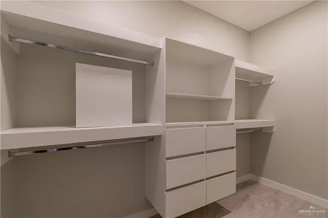 a view of an empty walk in closet