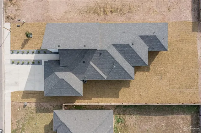 an aerial view of a house with swimming pool