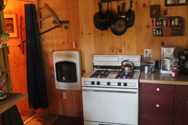 45 Back Street Newry, ME 04261 - Photo 7 of 13 Wall heater in the kitchen area
