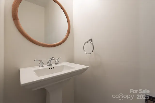 a bathroom with a sink and mirror