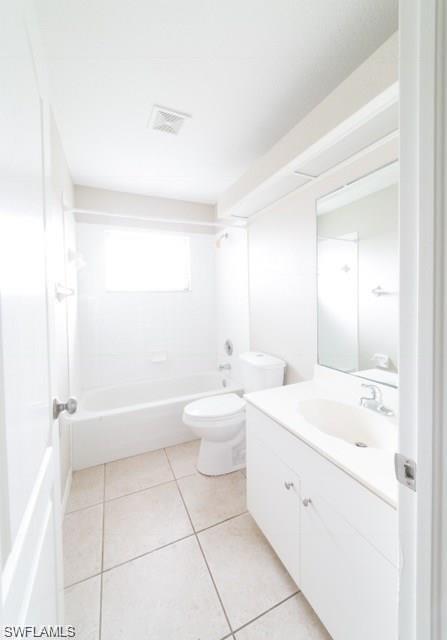 18513 Olive Road Fort Myers, FL 33967 - Photo 11 of 15 a bathroom with a double vanity sink toilet mirror and bathtub