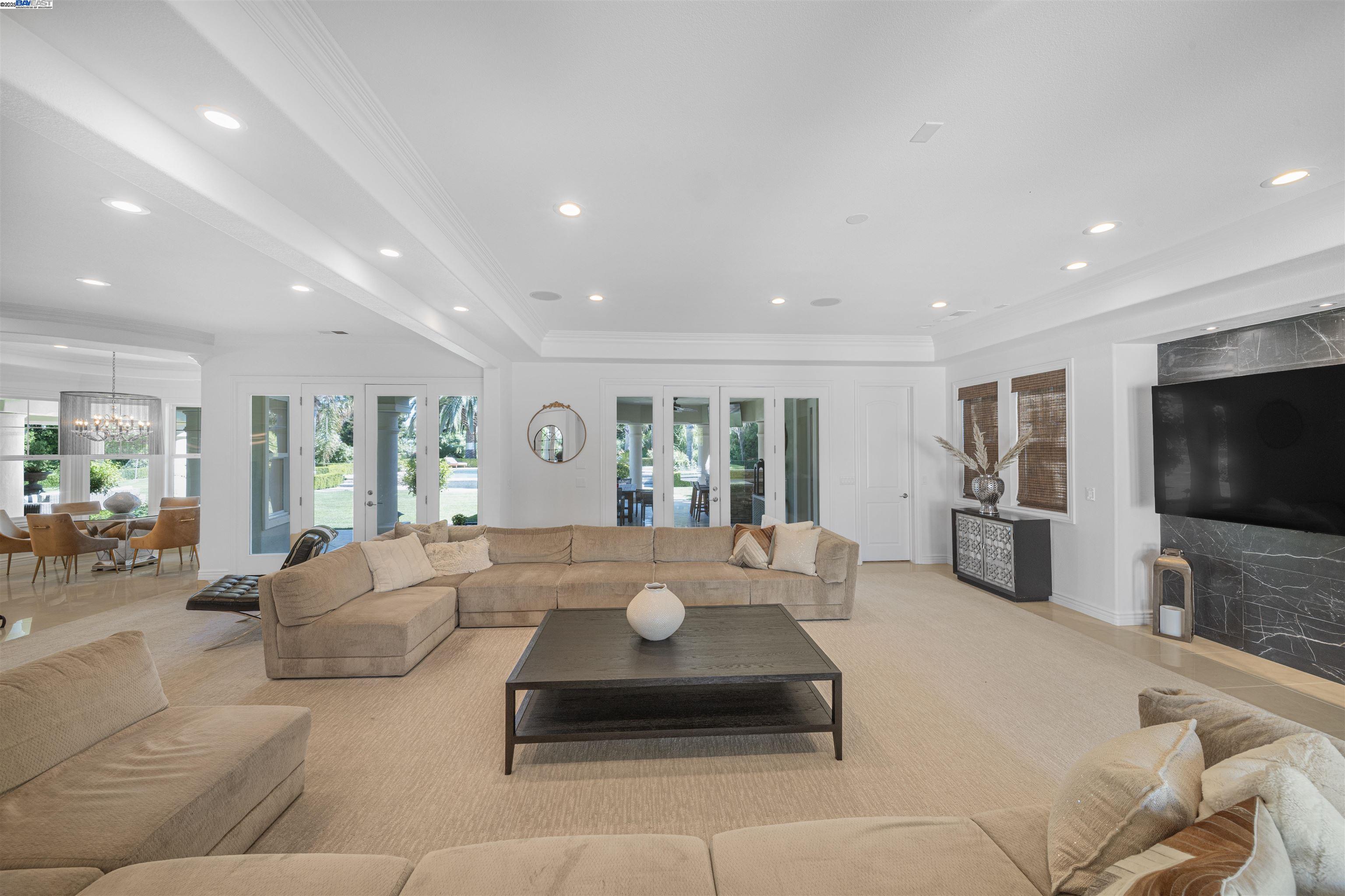 8324 Waterwell Way Tracy, CA 95304 - Photo 16 of 23 a large living room with furniture flat screen tv and a large window