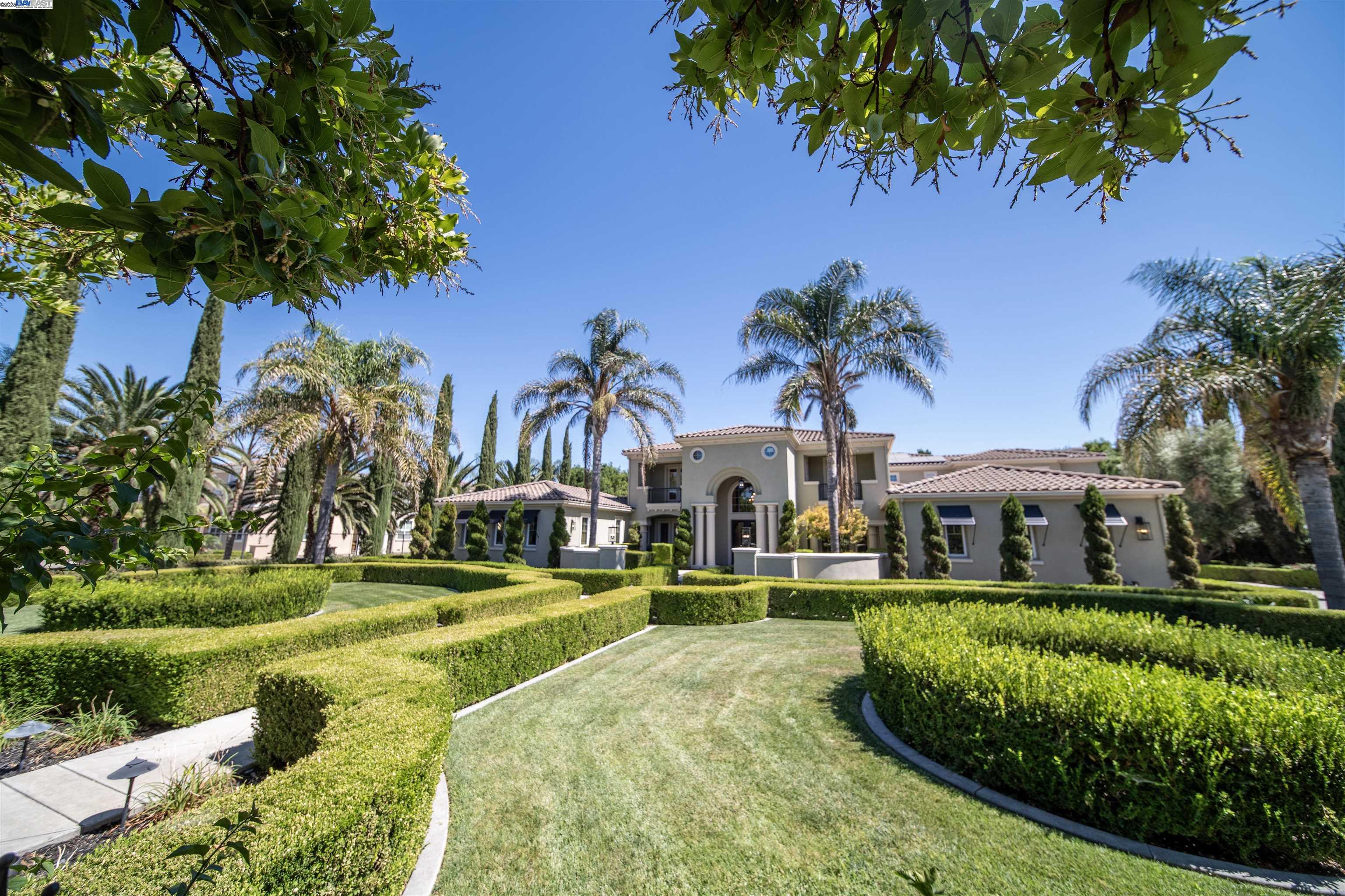 8324 Waterwell Way Tracy, CA 95304 - Photo 20 of 23 a view of a swimming pool with a garden and plants