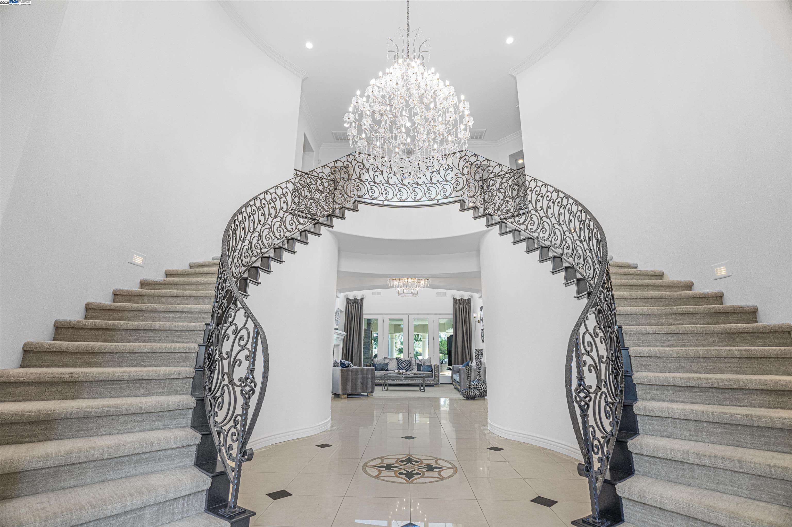 8324 Waterwell Way Tracy, CA 95304 - Photo 4 of 23 a view of entryway with a chandelier and wooden floor