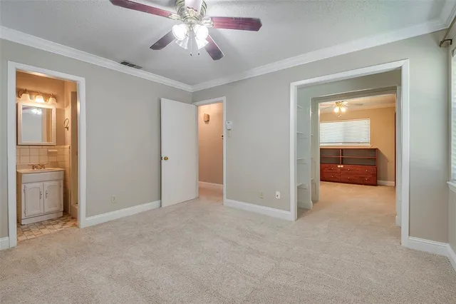 an empty room with a bathroom and a bathroom