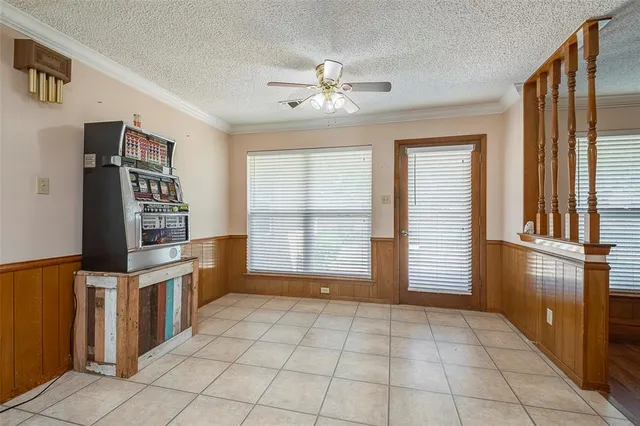 a view of a kitchen with microwave and windows