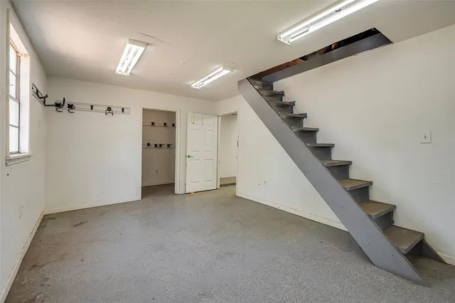 a view of a hallway with staircase