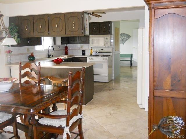 869 Miller Road Allenton, MI 48002 - Photo 7 of 22 MIller #8 dining into kitchen.jp