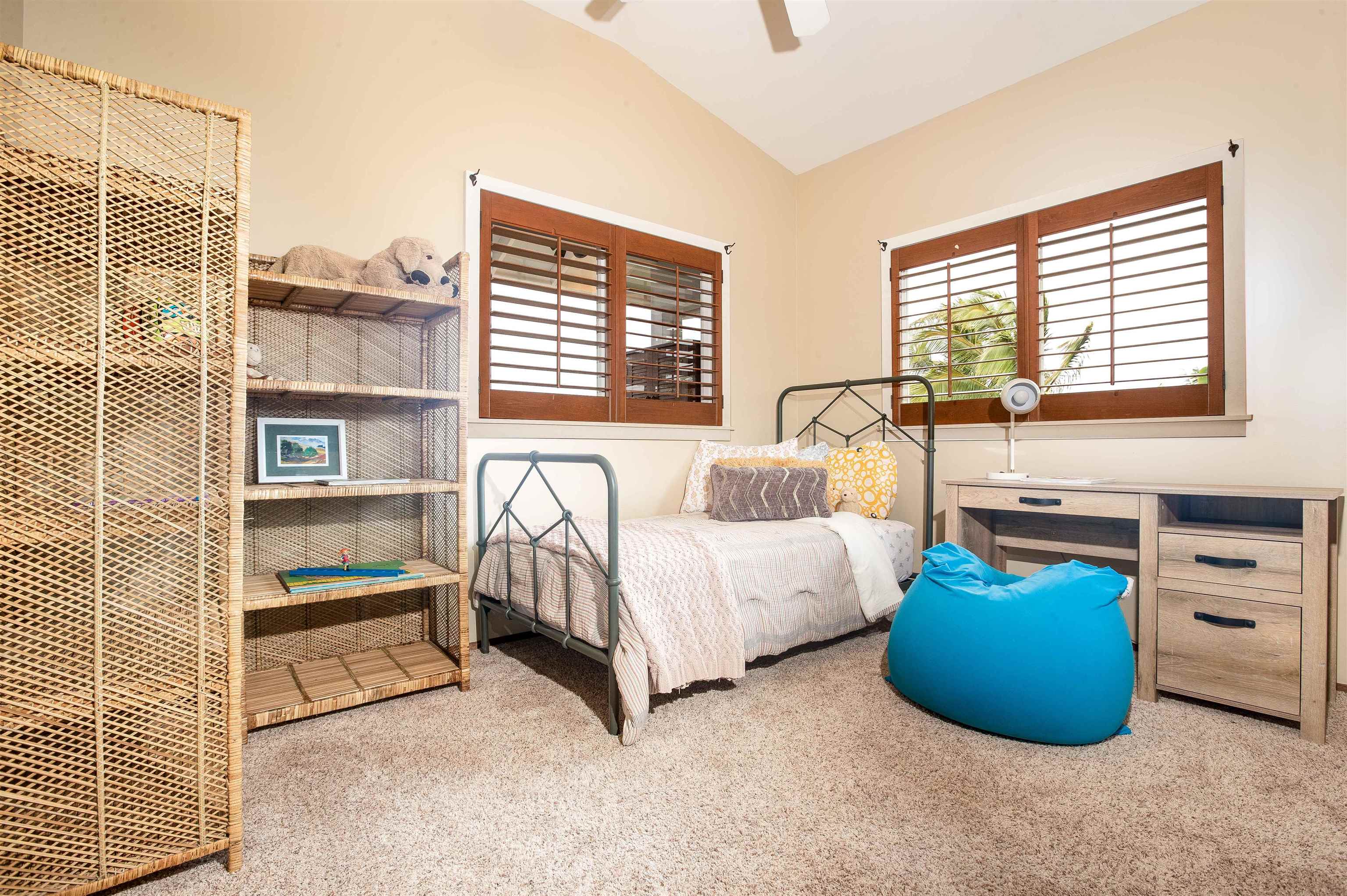 9 Kapii Place Haiku, HI 96708 - Photo 14 of 30 a bedroom with a bed and a window