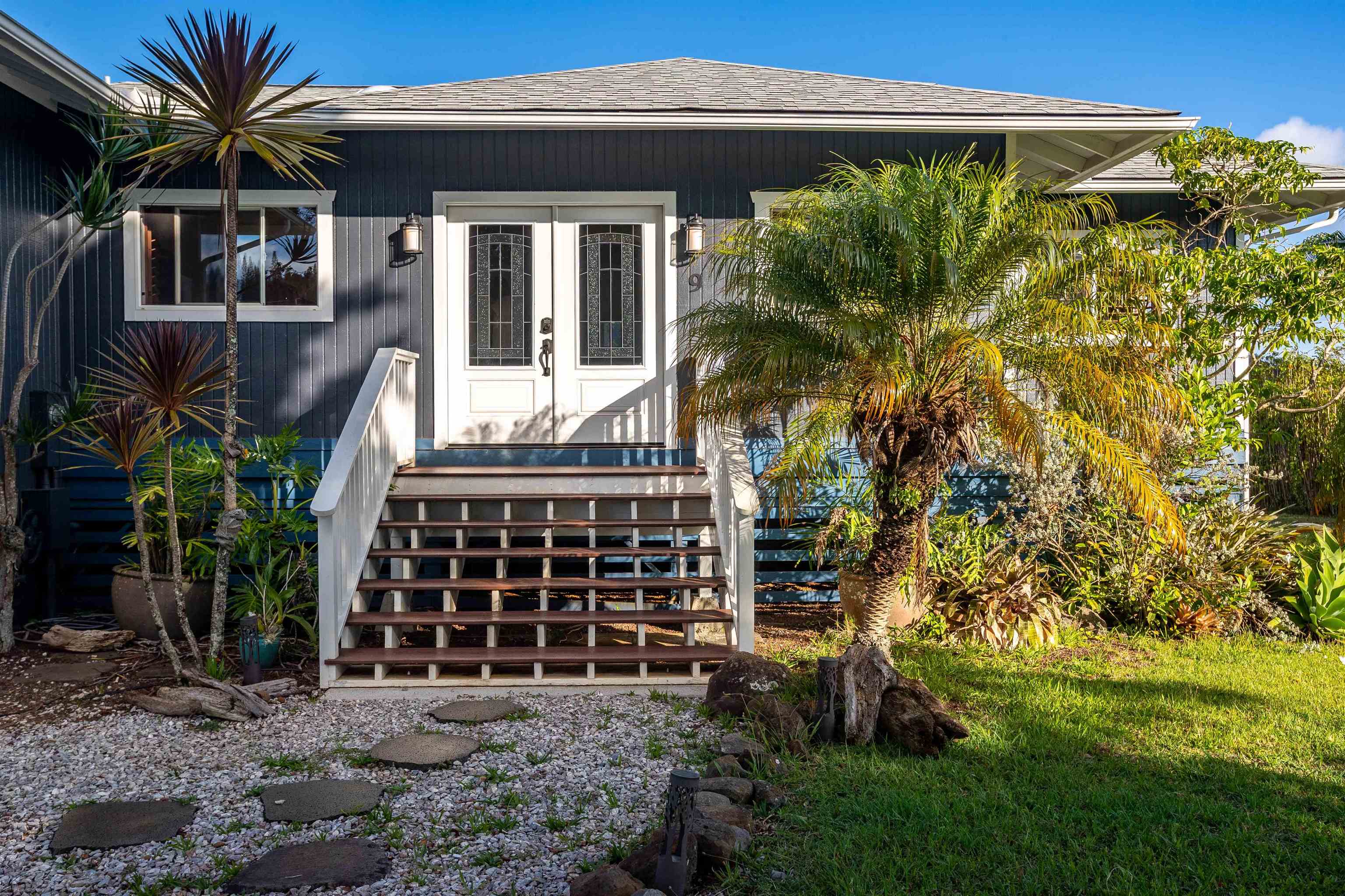 9 Kapii Place Haiku, HI 96708 - Photo 5 of 30 a front view of a house with a yard