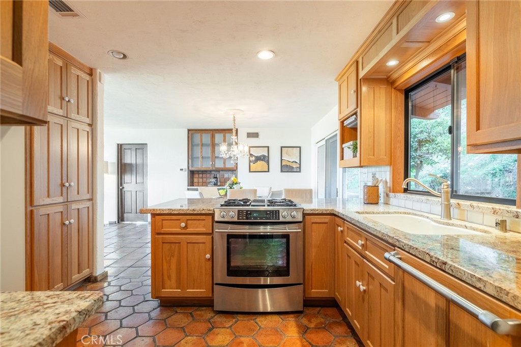 22 Deerhill Drive Rolling Hills Estates, CA 90274 - Photo 13 of 39 a kitchen with stainless steel appliances granite countertop a stove and a sink