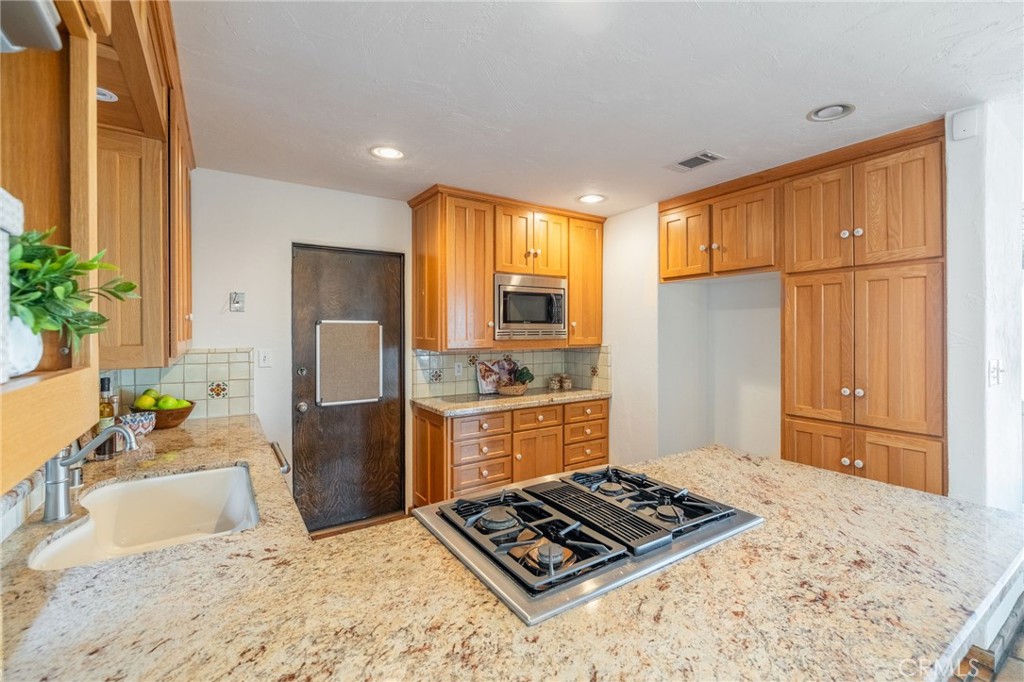 22 Deerhill Drive Rolling Hills Estates, CA 90274 - Photo 14 of 39 a kitchen with stainless steel appliances granite countertop a refrigerator stove and sink