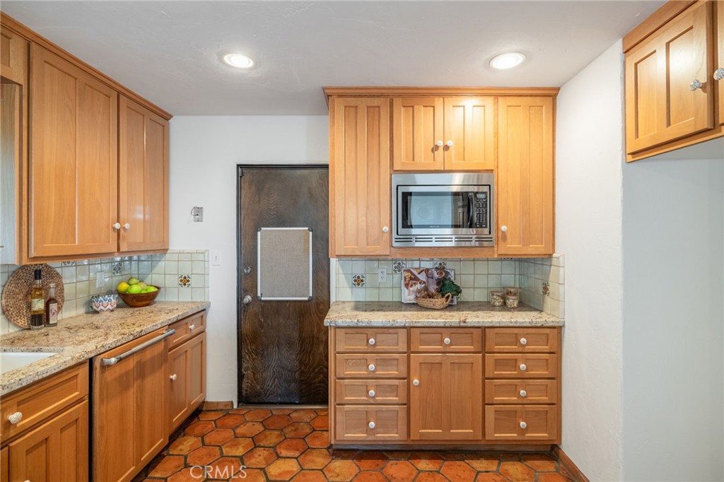 22 Deerhill Drive Rolling Hills Estates, CA 90274 - Photo 15 of 39 a kitchen with a refrigerator sink and cabinets