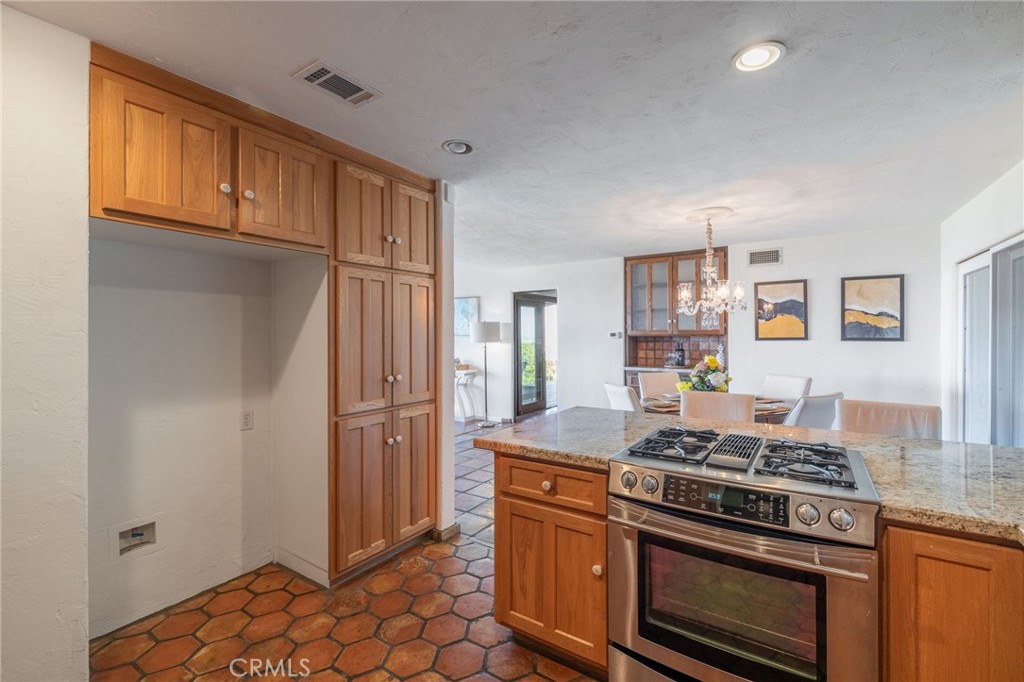 22 Deerhill Drive Rolling Hills Estates, CA 90274 - Photo 17 of 39 a kitchen with stainless steel appliances granite countertop a stove and a refrigerator