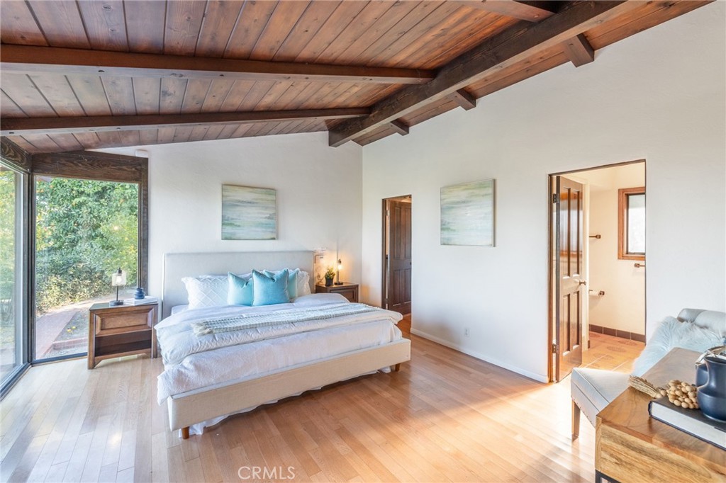 22 Deerhill Drive Rolling Hills Estates, CA 90274 - Photo 18 of 39 a bedroom with a bed and wooden floor