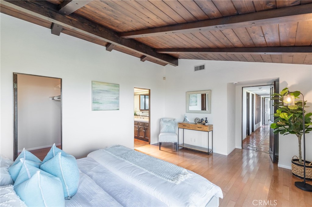22 Deerhill Drive Rolling Hills Estates, CA 90274 - Photo 19 of 39 a bedroom with furniture and wooden floor