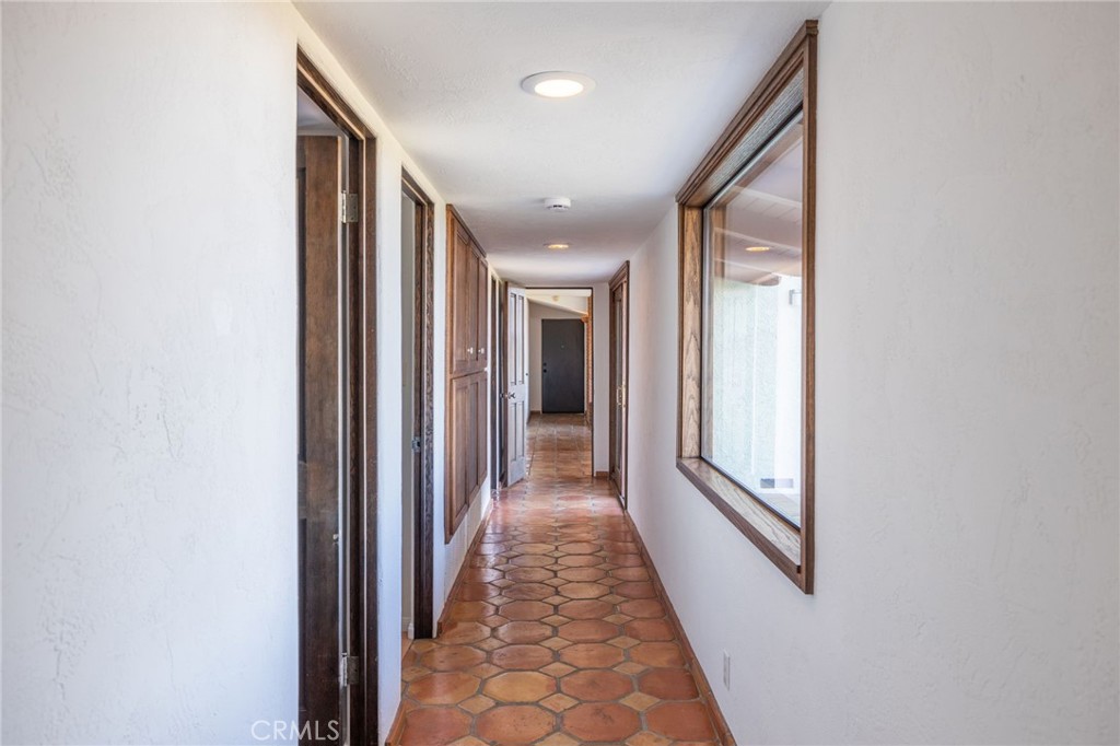 22 Deerhill Drive Rolling Hills Estates, CA 90274 - Photo 25 of 39 a view of a hallway with wooden floor and windows