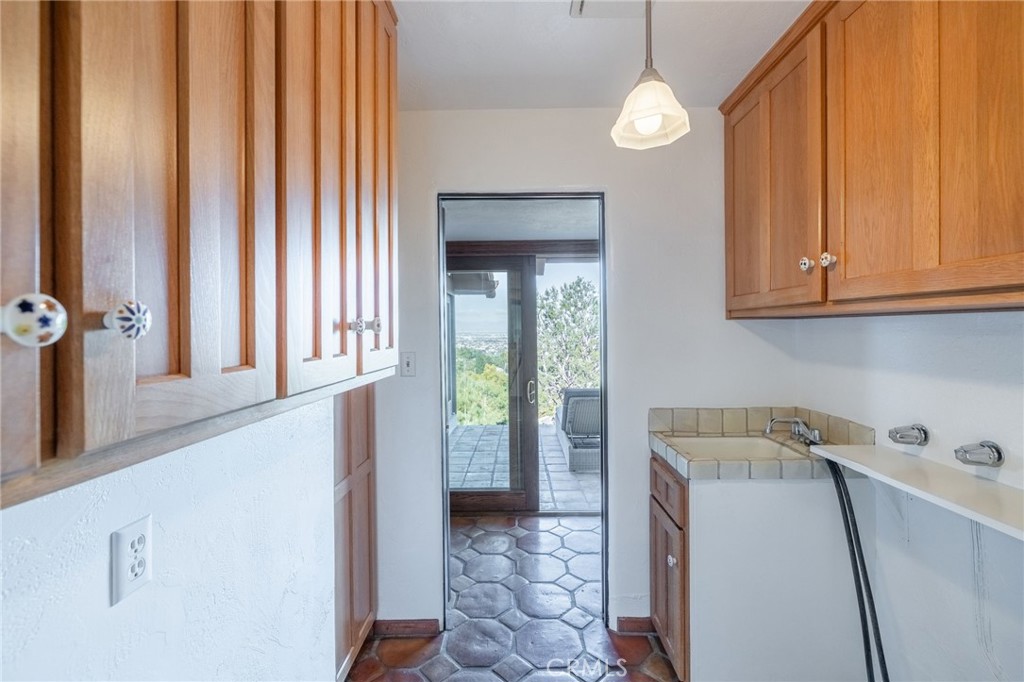 22 Deerhill Drive Rolling Hills Estates, CA 90274 - Photo 26 of 39 a bathroom with a sink and a washing machine
