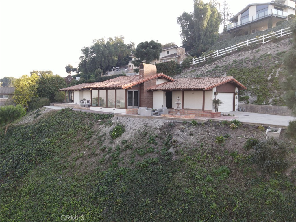 22 Deerhill Drive Rolling Hills Estates, CA 90274 - Photo 39 of 39 a view of a big house with a big yard plants and large trees