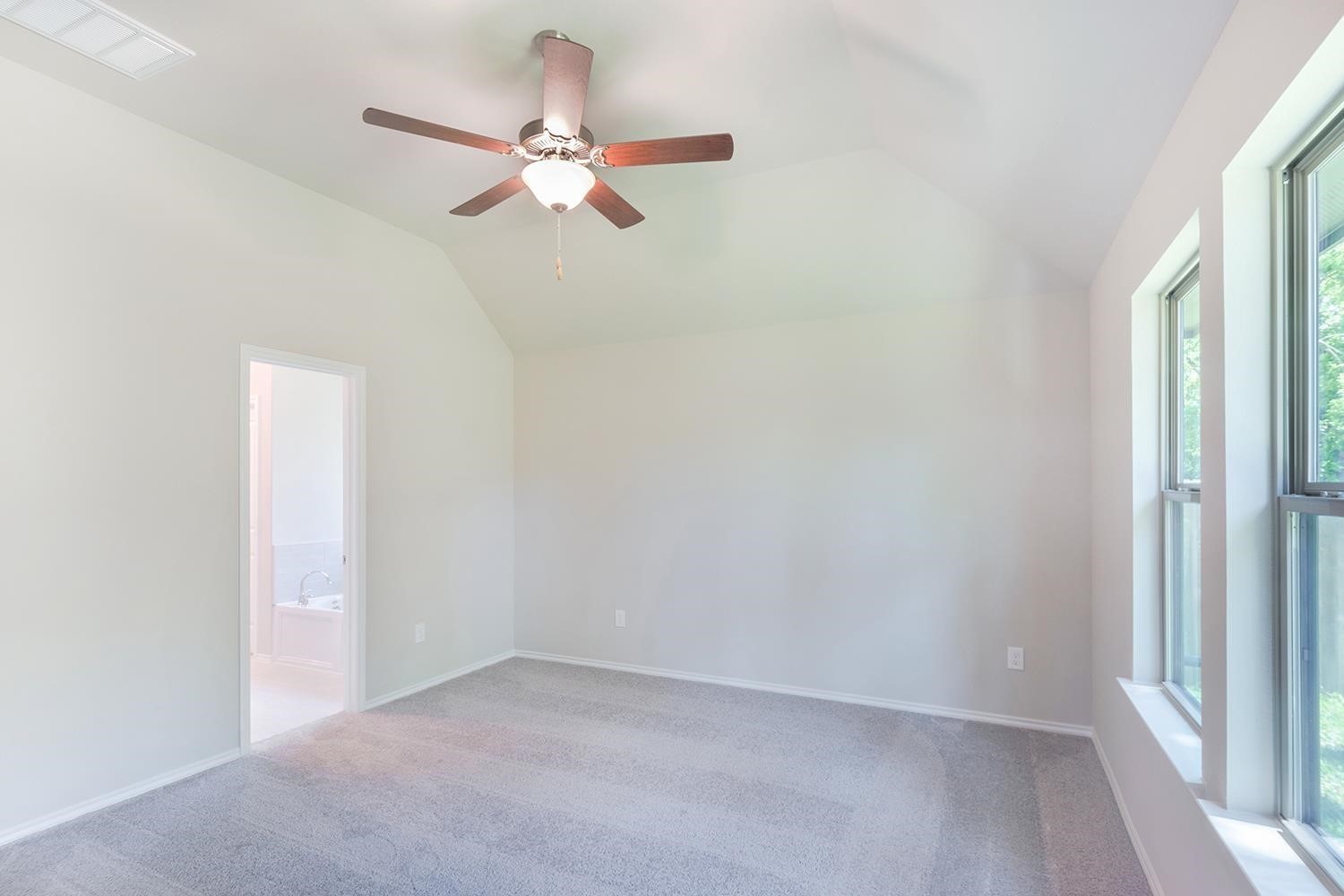 553 Timber Voyage Court Conroe, TX 77304 - Photo 15 of 31 a view of a room with a fan