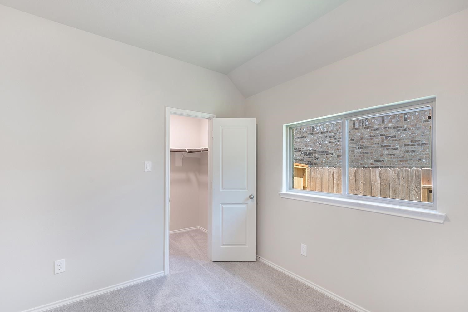 553 Timber Voyage Court Conroe, TX 77304 - Photo 18 of 31 a view of an empty room with a window
