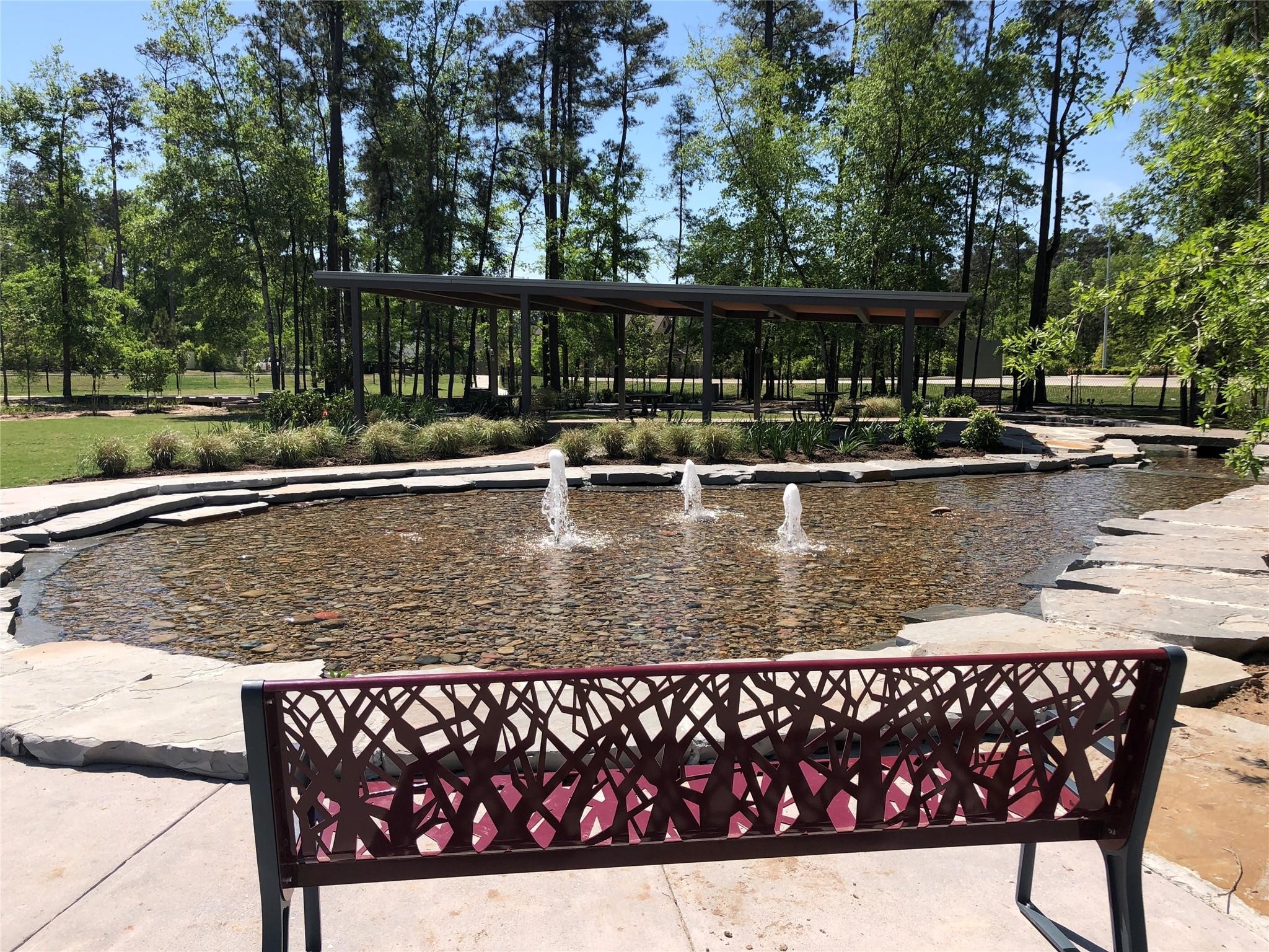 553 Timber Voyage Court Conroe, TX 77304 - Photo 27 of 31 a view of swimming pool with chairs and wooden fence