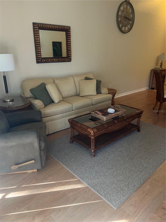 5373 Compass Point, Unit 1 Oxford, FL 34484 - Photo 12 of 38 a living room with furniture and a table
