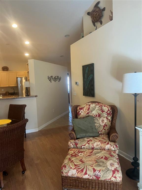 5373 Compass Point, Unit 1 Oxford, FL 34484 - Photo 14 of 38 a bed room with a bed and a chair