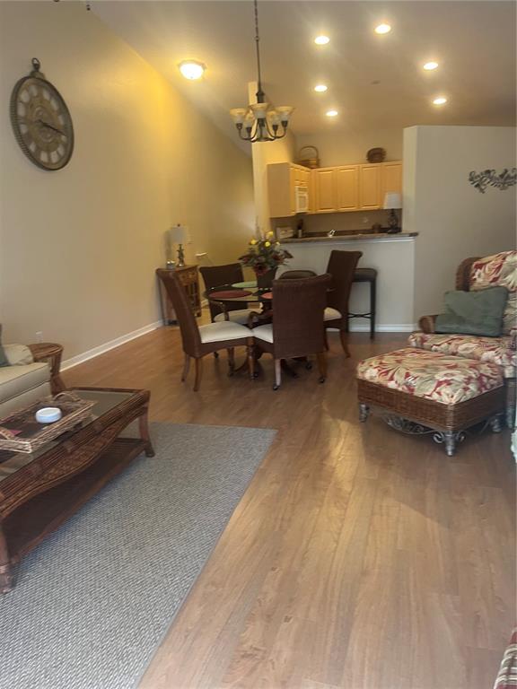 5373 Compass Point, Unit 1 Oxford, FL 34484 - Photo 15 of 38 a living room with furniture and a chandelier