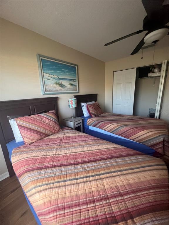5373 Compass Point, Unit 1 Oxford, FL 34484 - Photo 21 of 38 a bedroom with a large bed and a lamp on dresser