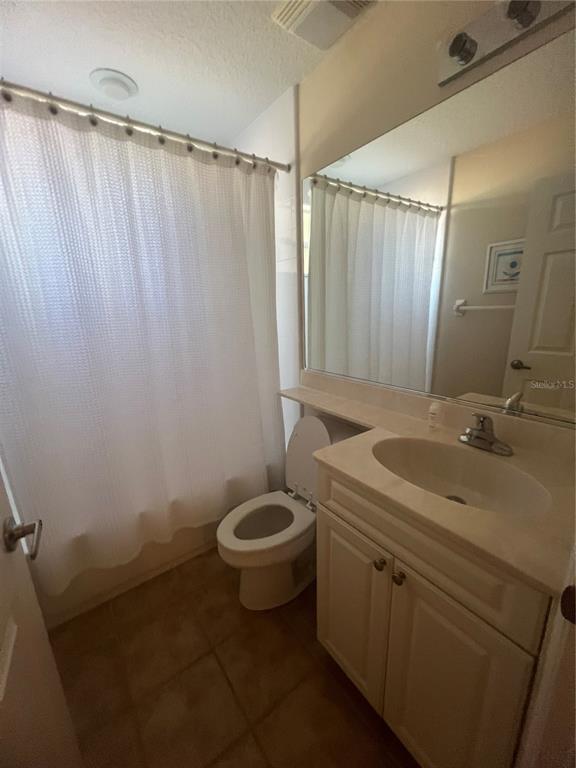 5373 Compass Point, Unit 1 Oxford, FL 34484 - Photo 23 of 38 a bathroom with a granite countertop sink and a mirror