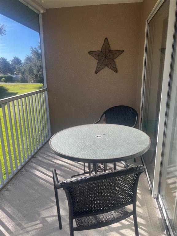 5373 Compass Point, Unit 1 Oxford, FL 34484 - Photo 27 of 38 a view of a balcony and chairs