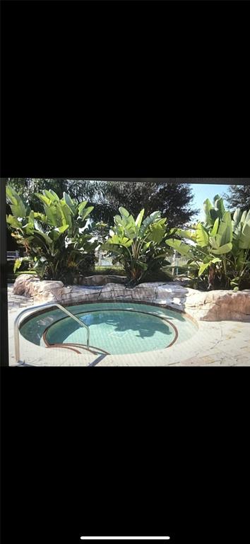 5373 Compass Point, Unit 1 Oxford, FL 34484 - Photo 33 of 38 a view of a swimming pool with an outdoor space