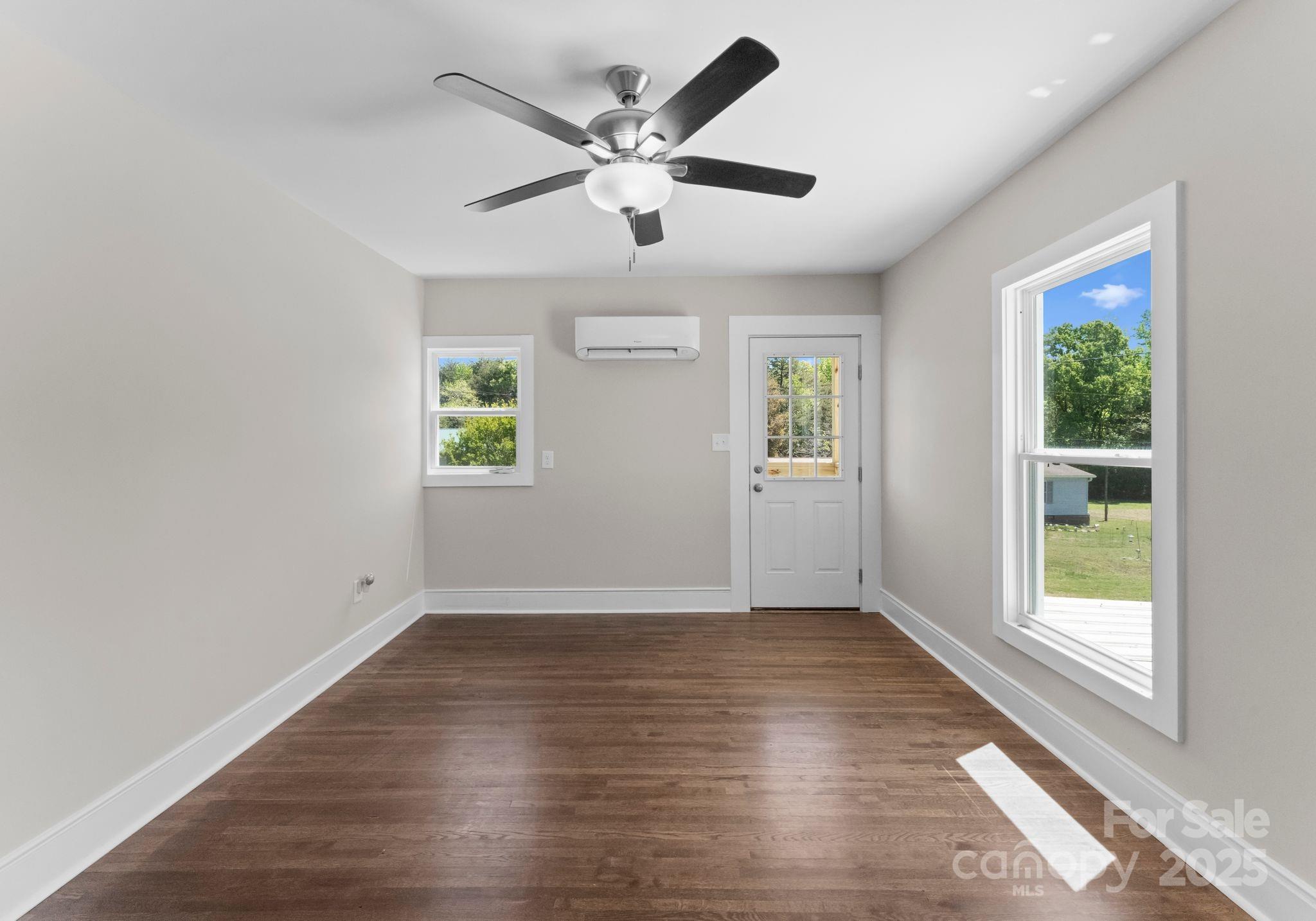 155 Jackson Road Salisbury, NC 28146 - Photo 13 of 26 a view of an empty room with wooden floor and a window