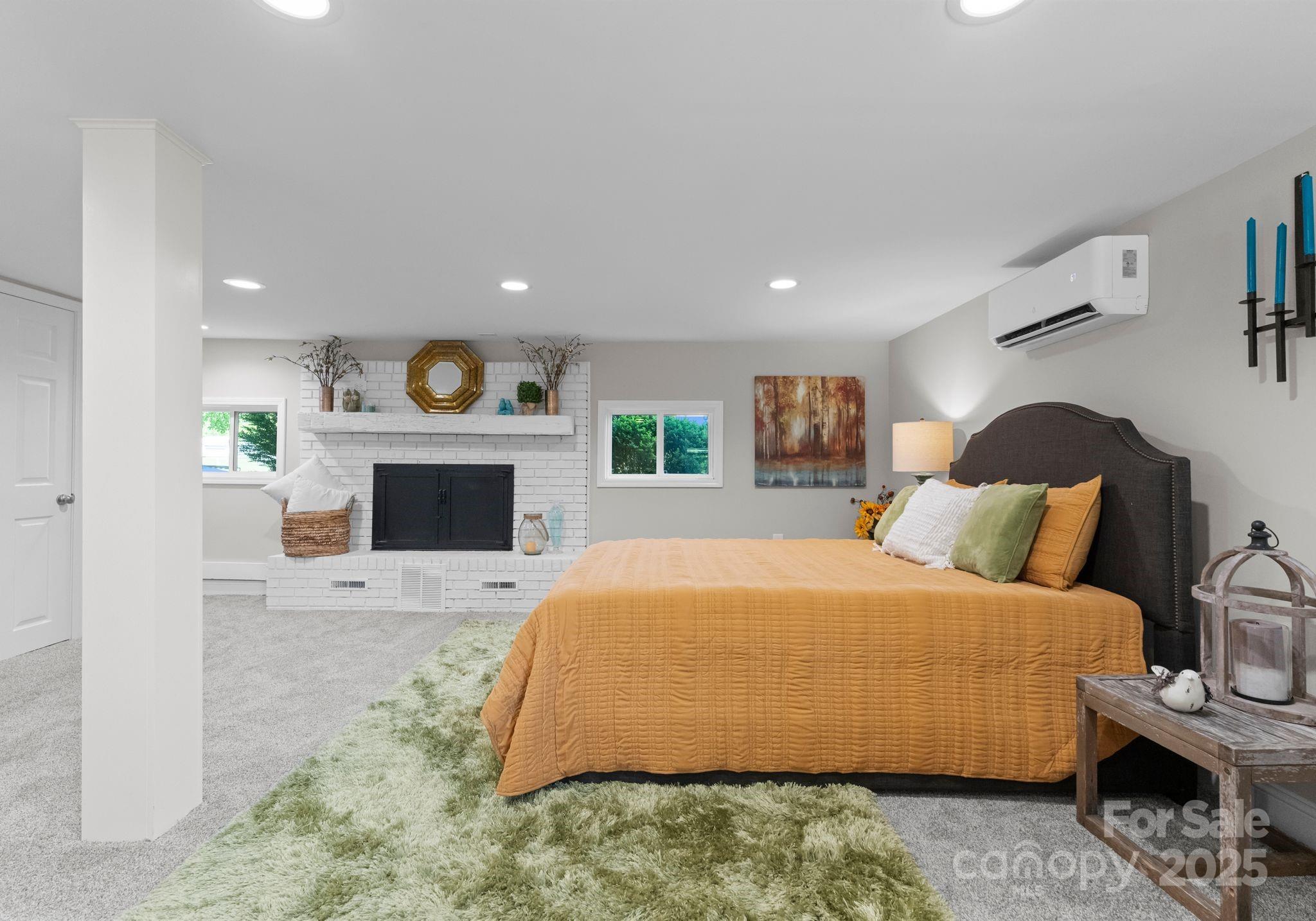 155 Jackson Road Salisbury, NC 28146 - Photo 18 of 26 a bedroom with a bed and a fireplace