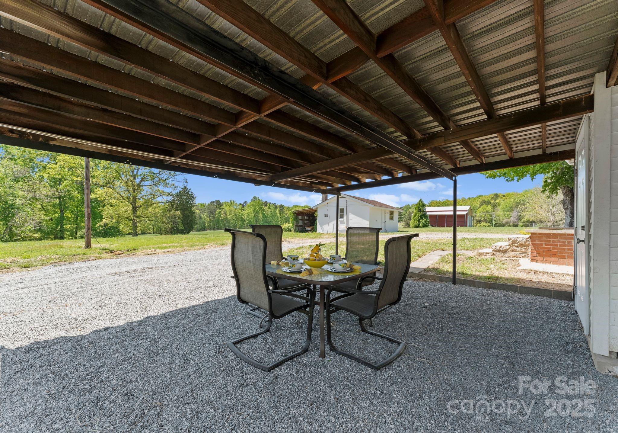 155 Jackson Road Salisbury, NC 28146 - Photo 20 of 26 a view of a porch with furniture and a yard